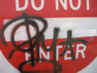Graffiti on Do Not Enter Sign