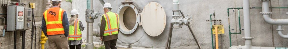 Project Manager discussing components of the bio-gas conversion project