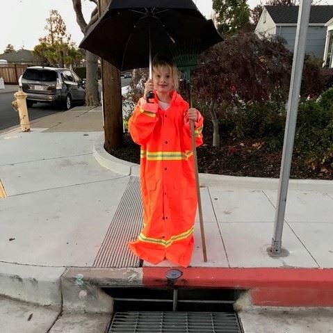 girl with black umbrella over her drain