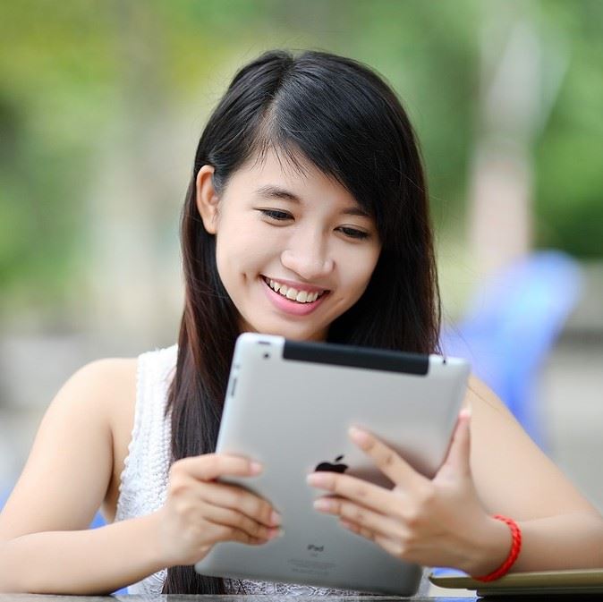 Woman reading tablet 