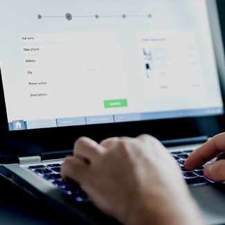 Person filling out an application on their computer