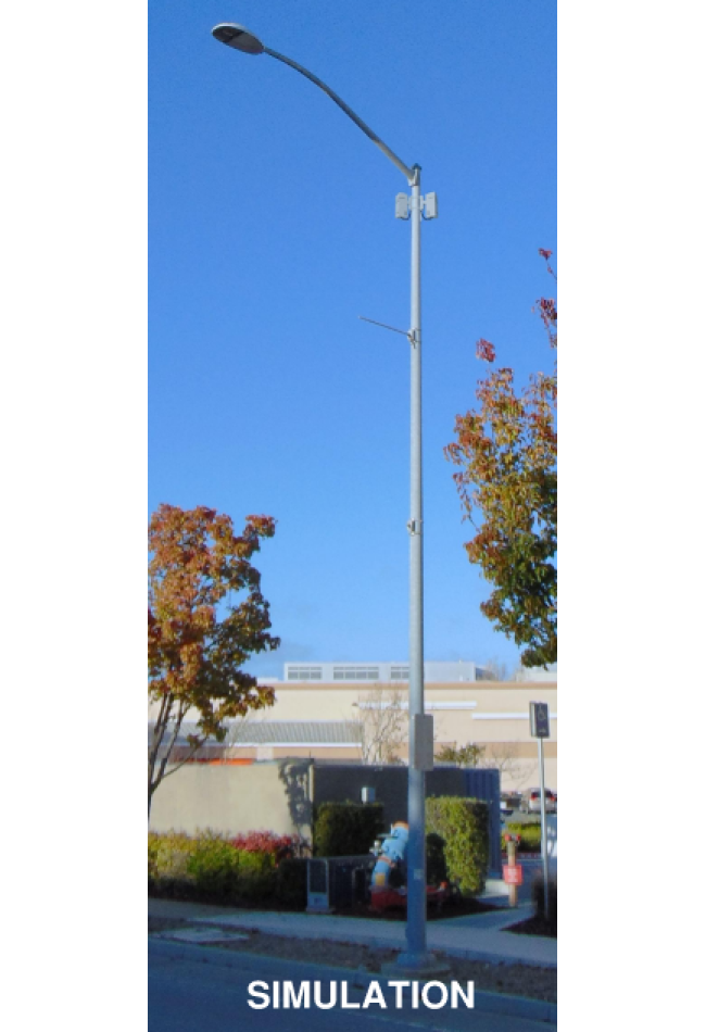 Photo of a simulated small cell facility pole-mounted on a city streetlight