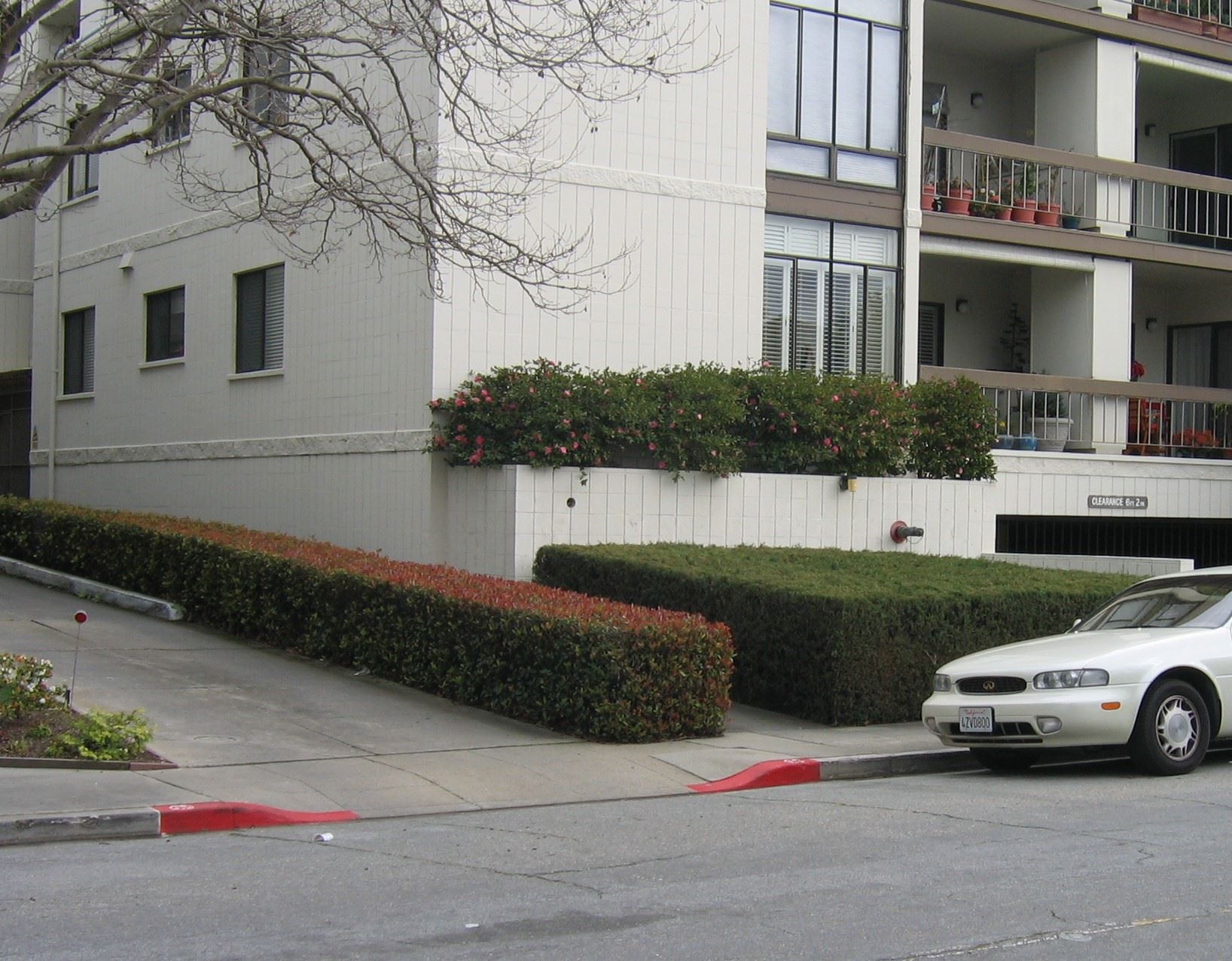 Example of Red Tipping a Driveway in a neighborhood - shows red paint on both sides of a driveway. 
